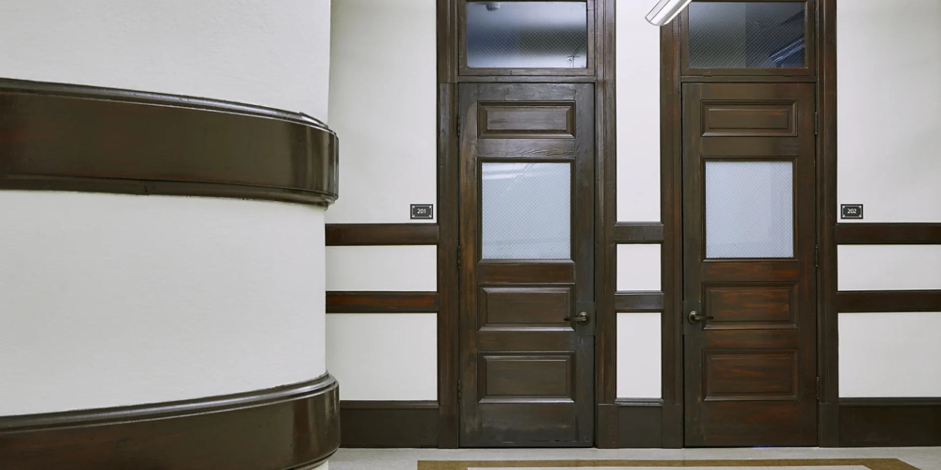 hallway with apartment entrance doors