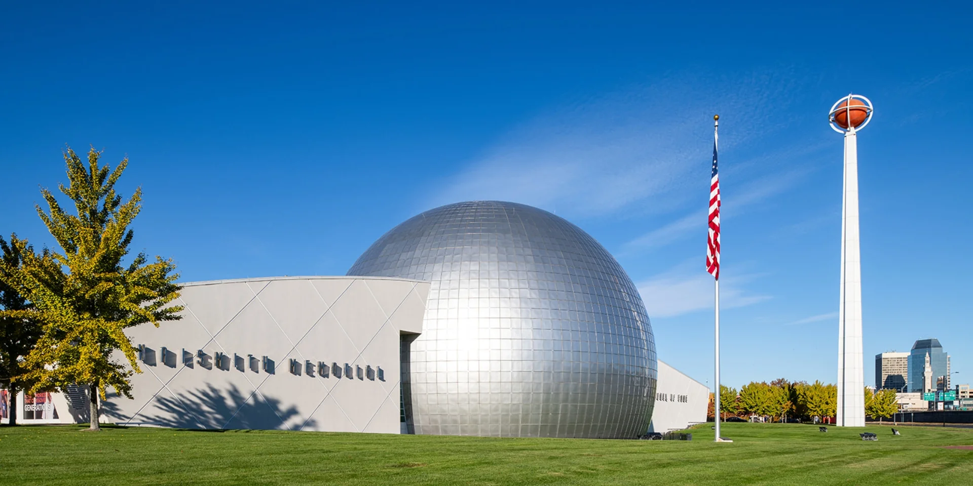 exterior dome, building, sign, flag, and basketball tower