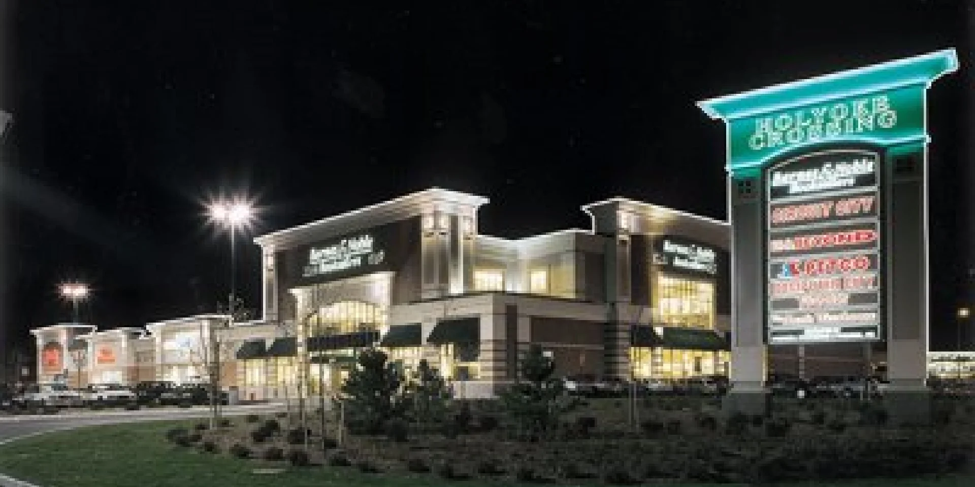 plaza sign and building exterior at night