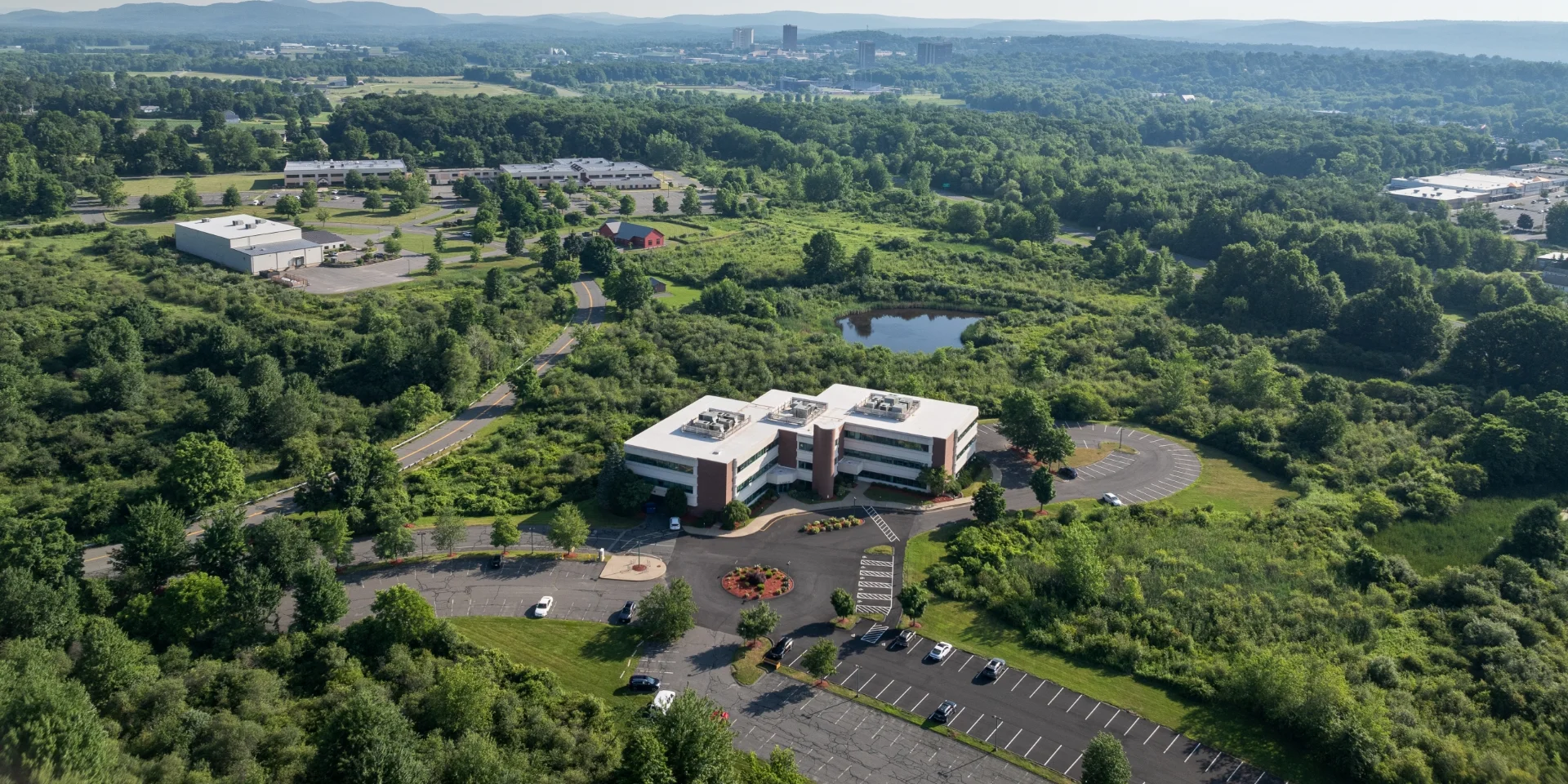 aerial of building exterior, roof, and property