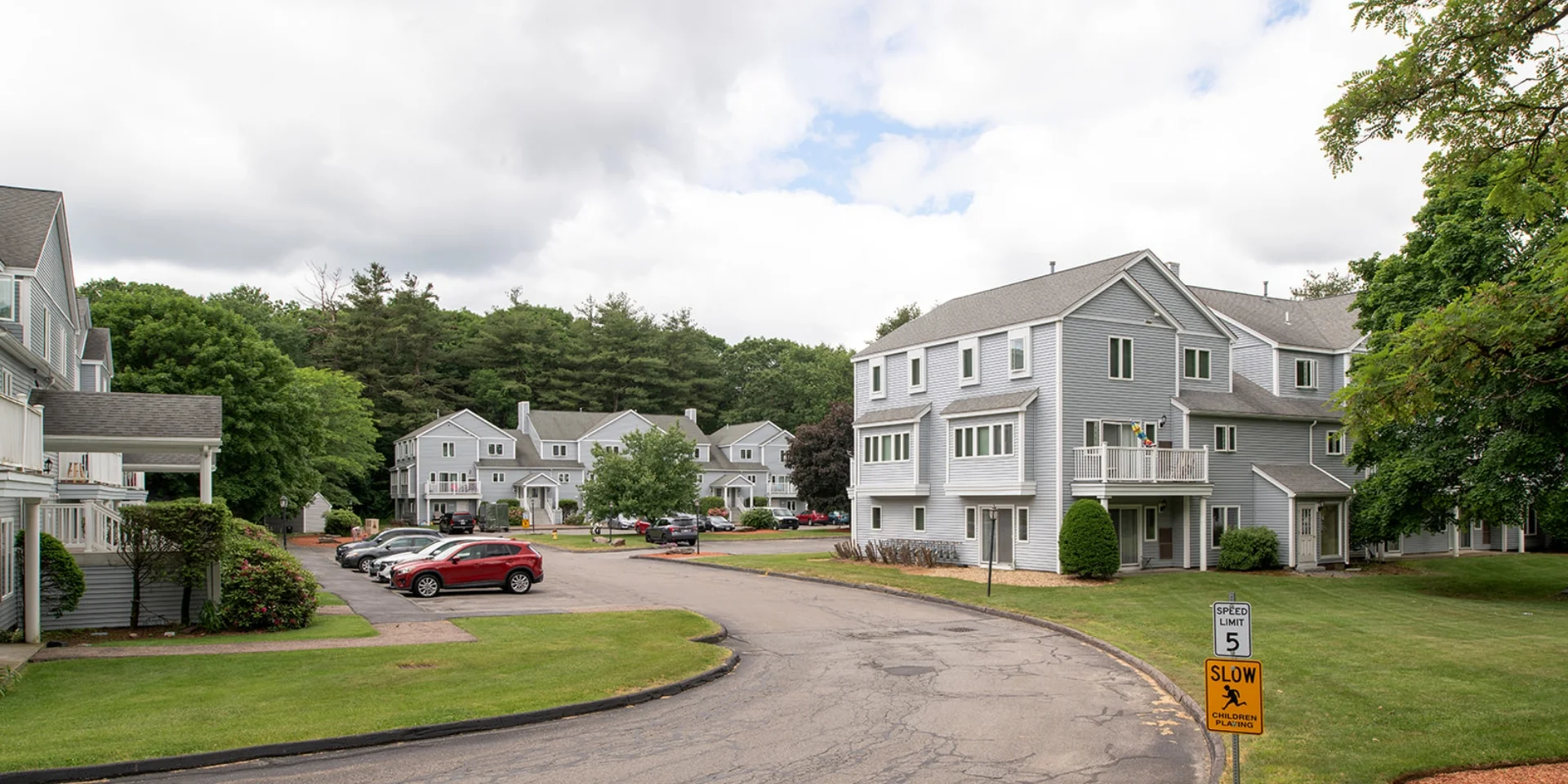 view of apartment buildings from main entry road