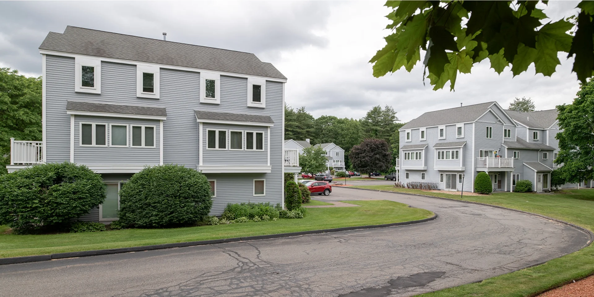 view of apartment buildings from main entry road